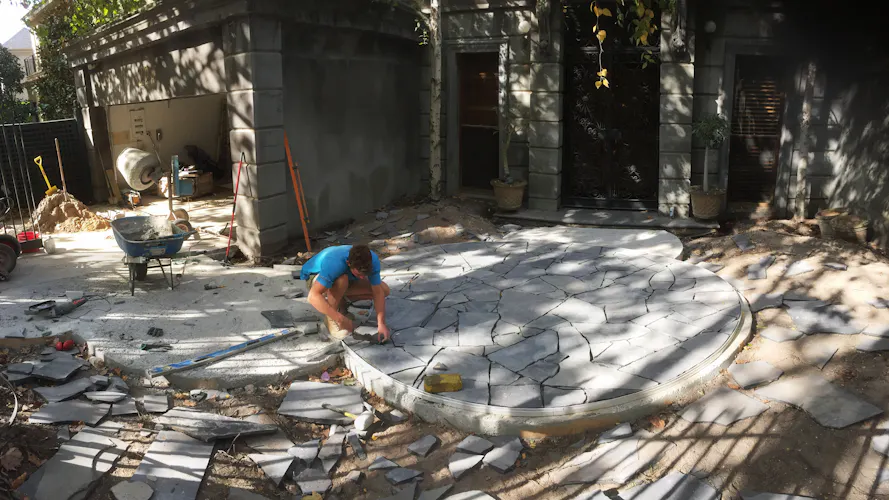 Toorak, Melbourne front yard and entrance area landscaping work including circular paved areas being constructed