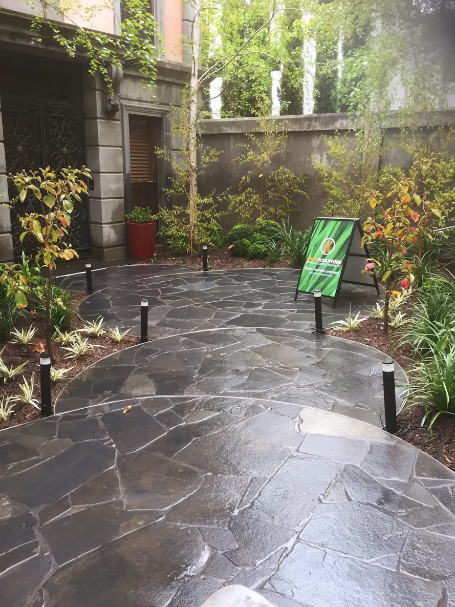 Toorak, Melbourne front yard and entrance area landscaping work including circular paved areas and planting